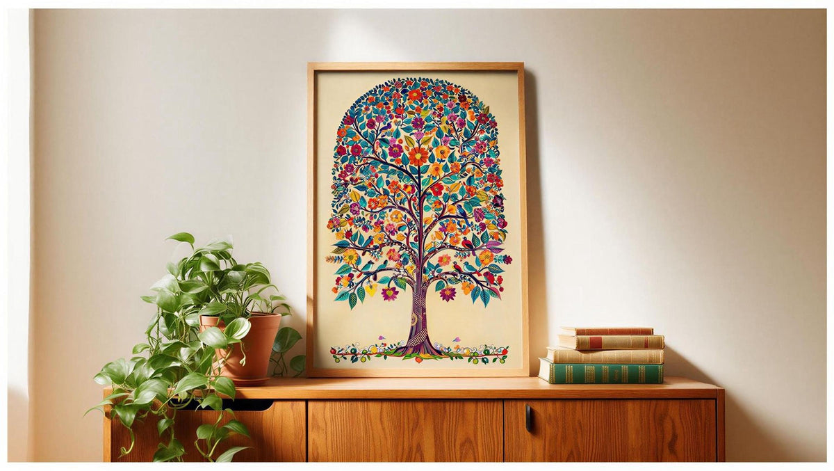 a wooden cabinet with a framed picture of a colorful tree on top of it, along with a potted plant and some books.