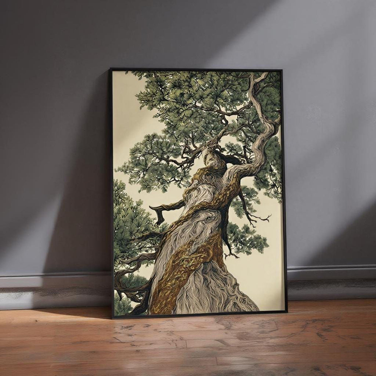 A framed painting depicting a large, twisted tree with a gnarled trunk and lush green foliage, standing on a wooden floor against a gray wall.