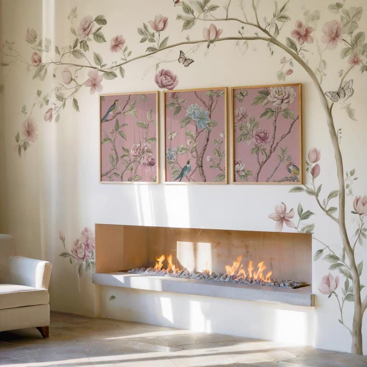 a cozy living room with a fireplace, a white sofa, and a wall adorned with three framed floral paintings. The paintings depict pink flowers and butterflies, creating a warm and inviting atmosphere.