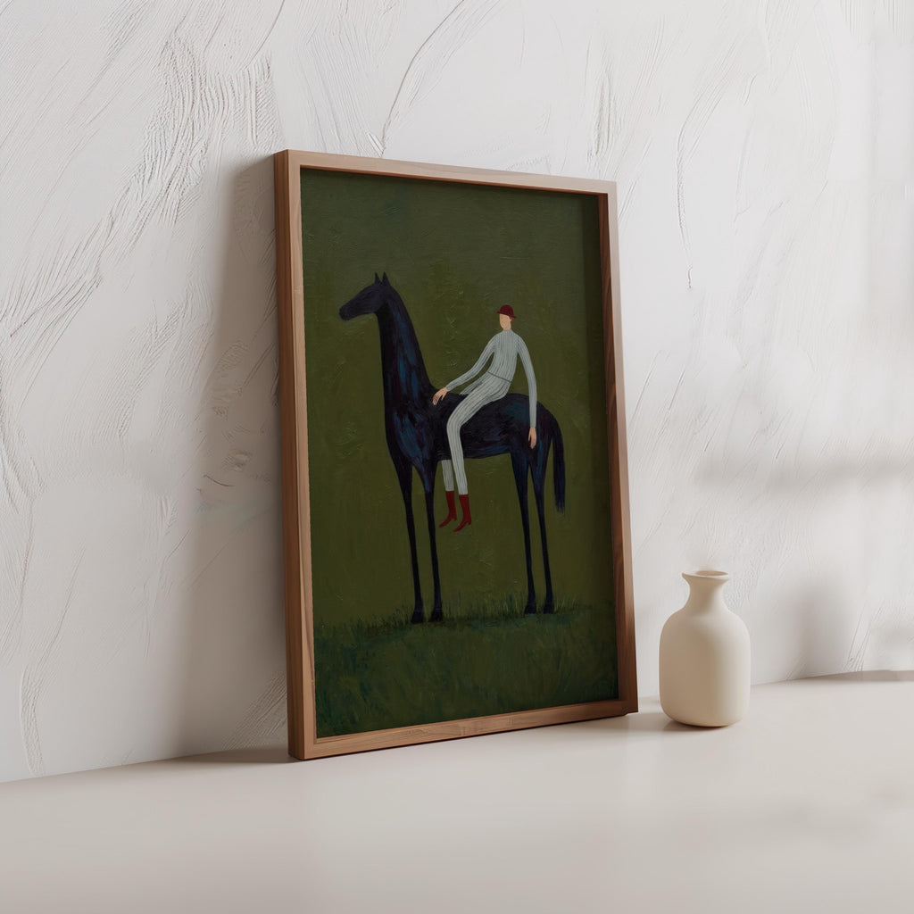 Framed modern equestrian art leaning on textured plaster, dark horse with small red accents on green.