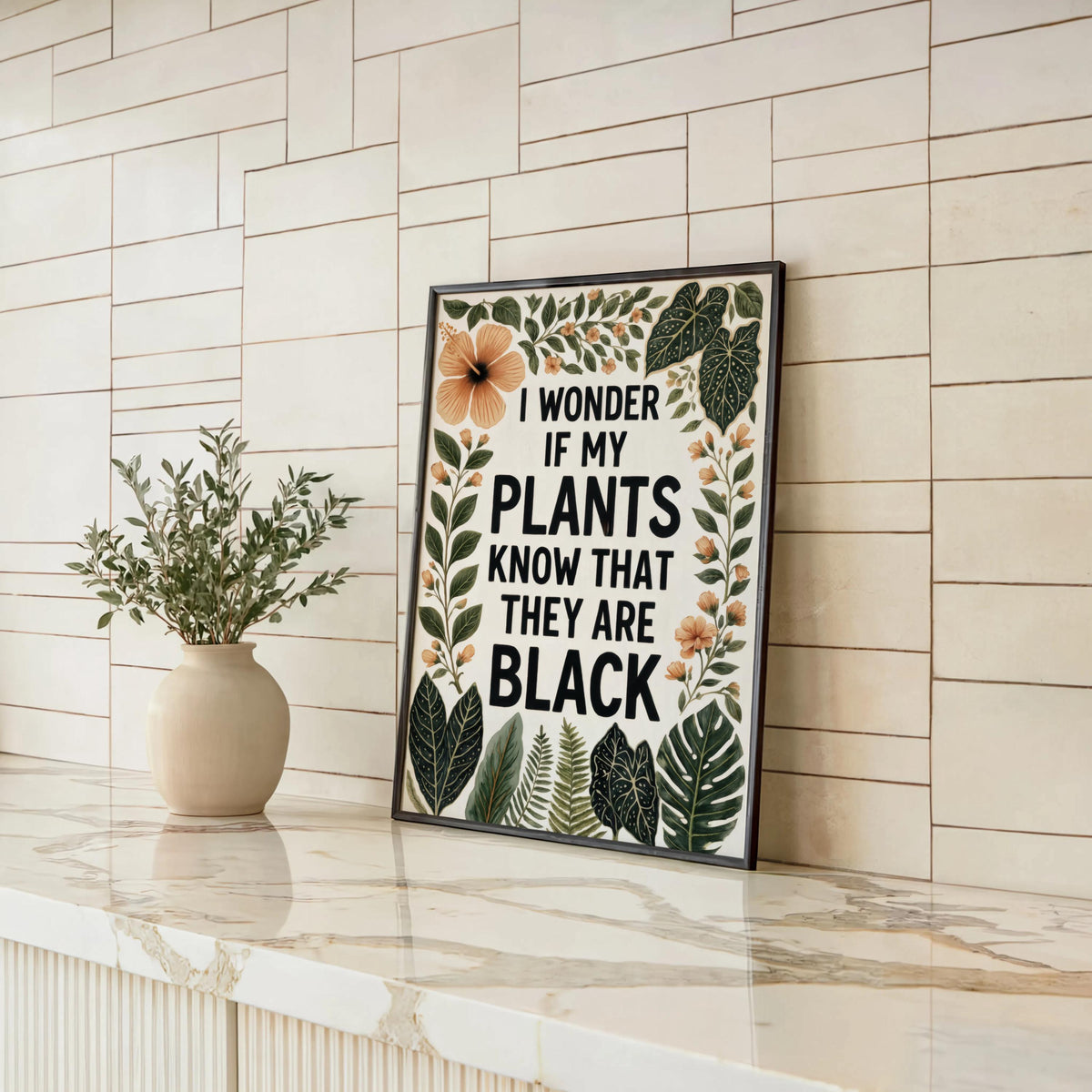 Leaned frame on marble ledge, small ceramic vase, tropical botanical typography, black plant lover wall art