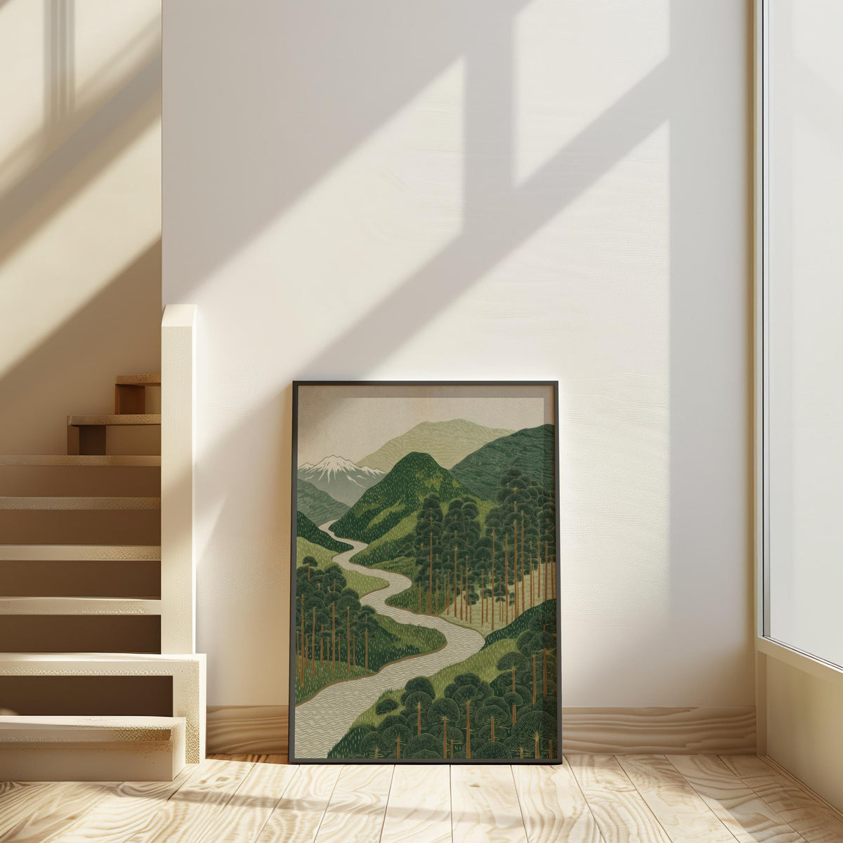 Tall stairwell shadows highlight framed Scandinavian Japandi wall art leaning on light wood floor