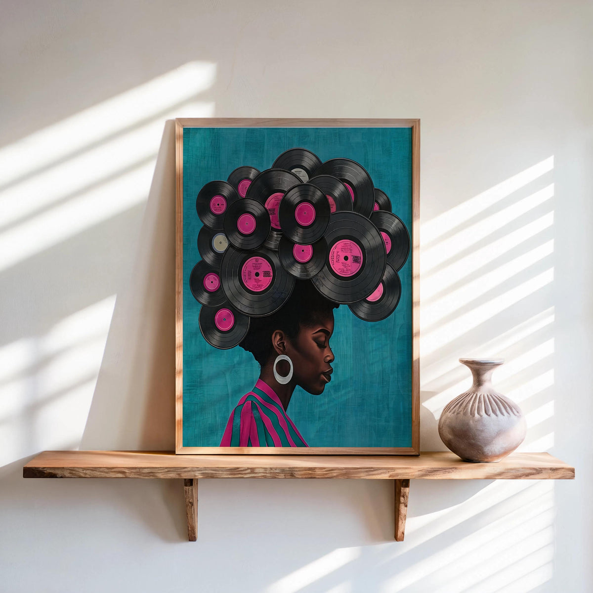 Framed teal variant leaning on a shelf, vinyl-record afro with pink labels, warm light, black woman vinyl record wall art