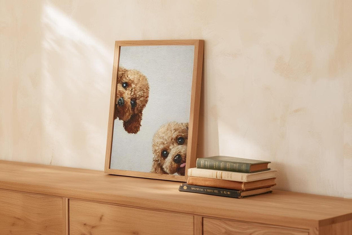 Warm beige vignette with framed goldendoodle wall art printable on dresser, playful curly puppy peeks in frame