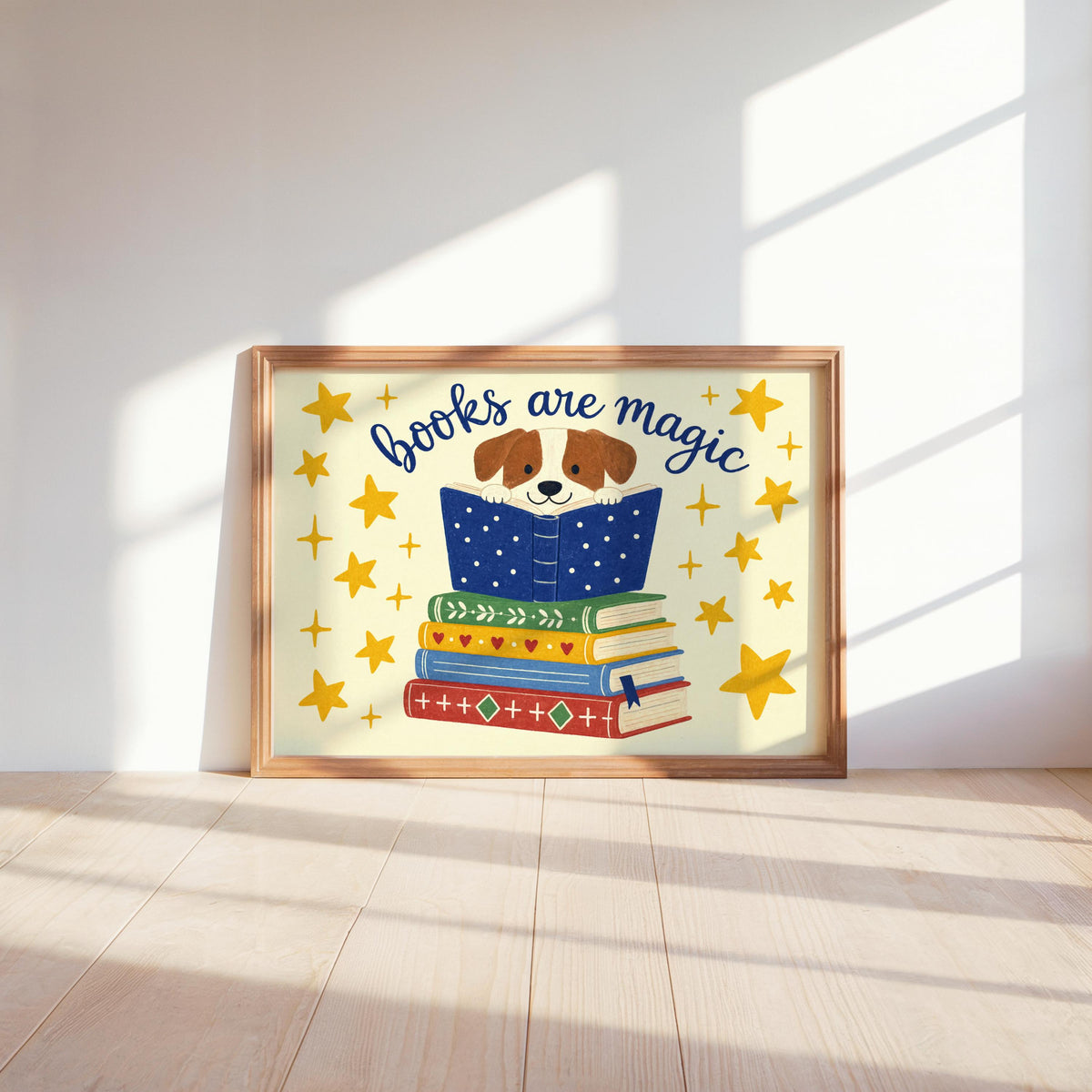 Dog reading wall art lit by bright sunlight on floor, warm cream tones, whimsical dog print for reading nook decor