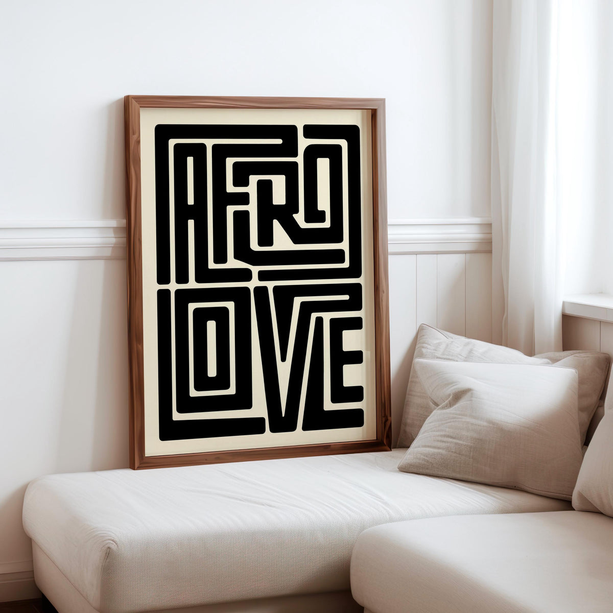 Afro Love wall art framed print beside sofa, cozy living room vignette, bold Afrocentric wall art focal point