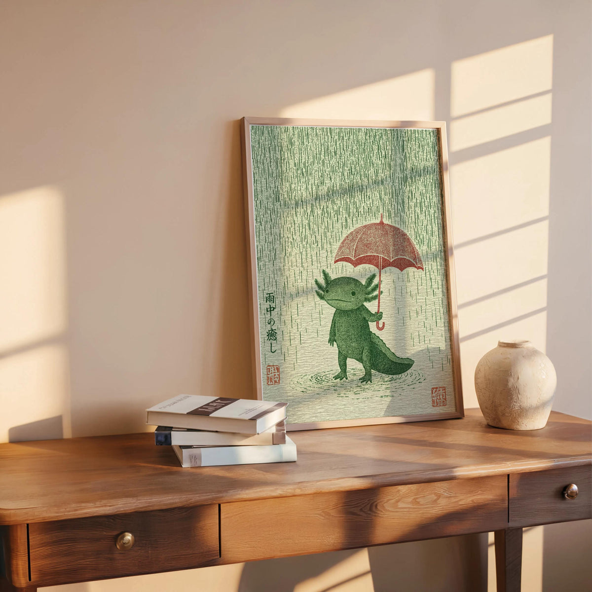 Axolotl Wall Art Print propped on a rustic table with books, soft sunlight, Japanese woodblock style texture