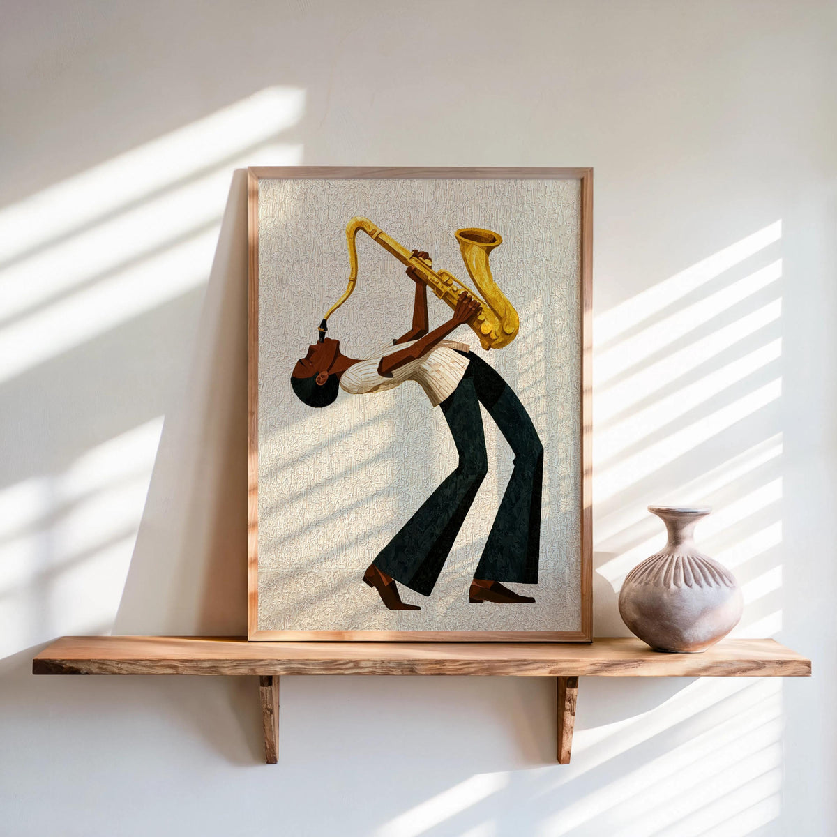 Afrocentric jazz wall art print on shelf, cream canvas texture, modernist saxophone player in profile.