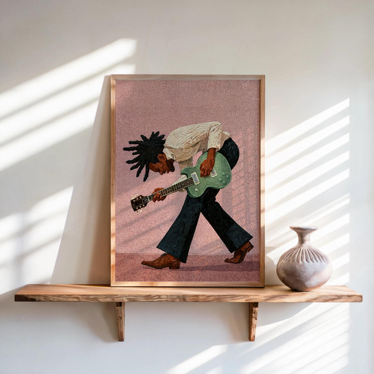 Soft pink backdrop framed print on shelf, expressive pose, Afrocentric wall art, Black musician wall art