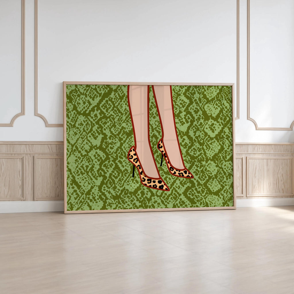 Vertical framed leopard print heels wall art propped against panelled wall, rich green snake-print, glam leopard pumps