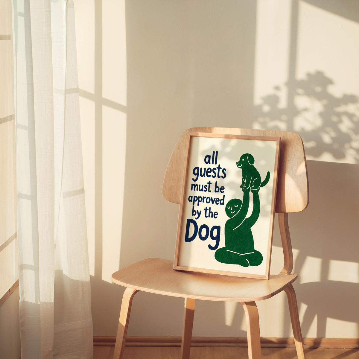 Green variant print propped on a wooden chair, warm sunlight and shadows, dog lover wall decor styled vignette