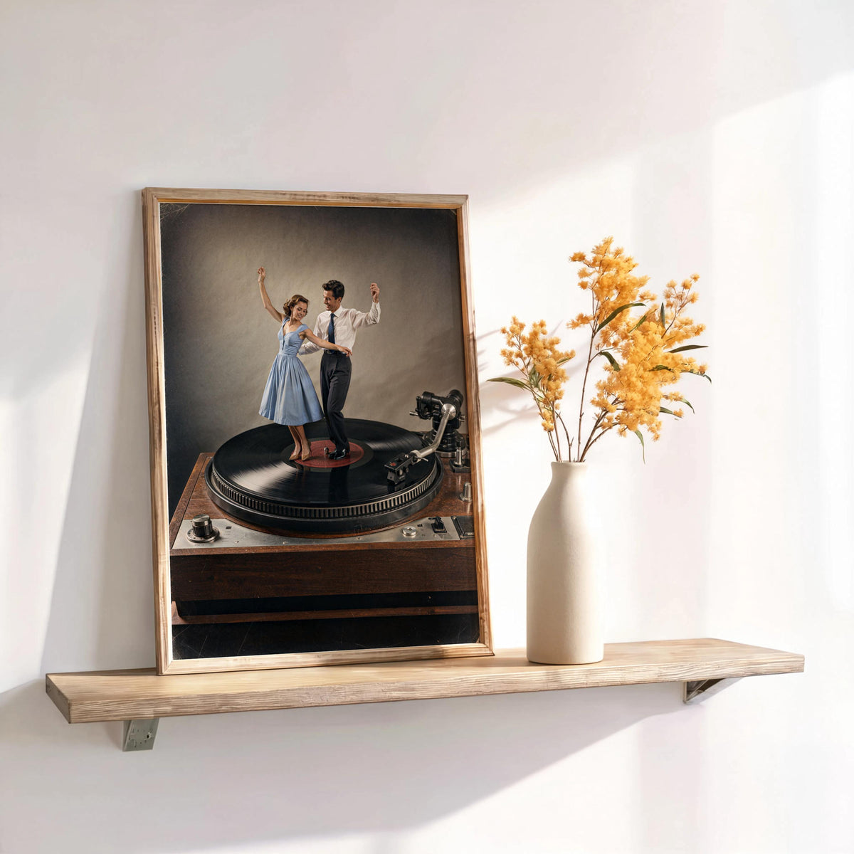 Leaning color record player wall art on shelf, muted blue dress and vinyl detail beside dried floral accent