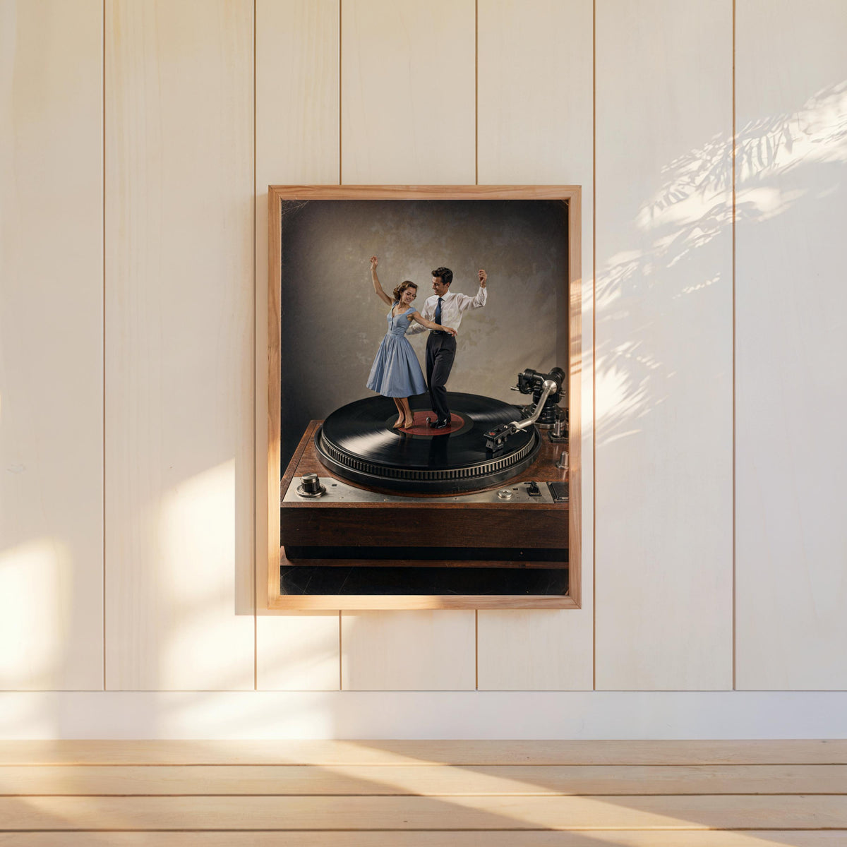 Color record player wall art hung on paneled wall, framed vintage record player print with warm light