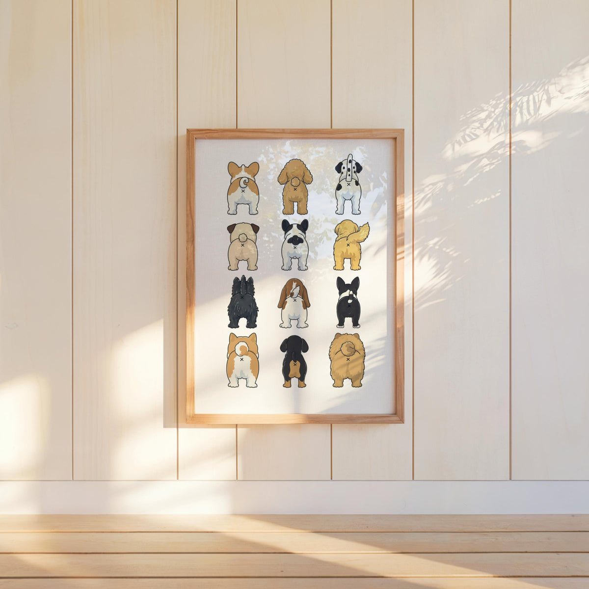 Hanging funny dog butt bathroom art print on pale paneled wall, modern Scandinavian vibe