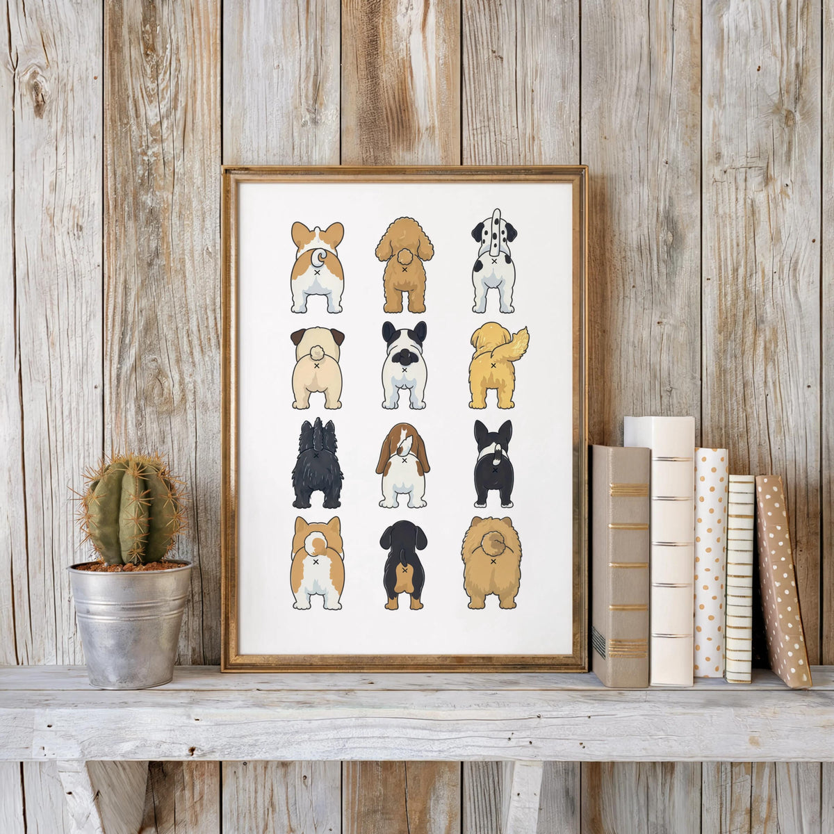 Framed funny dog butt bathroom art print against reclaimed wood wall, paired with cactus and stacked books