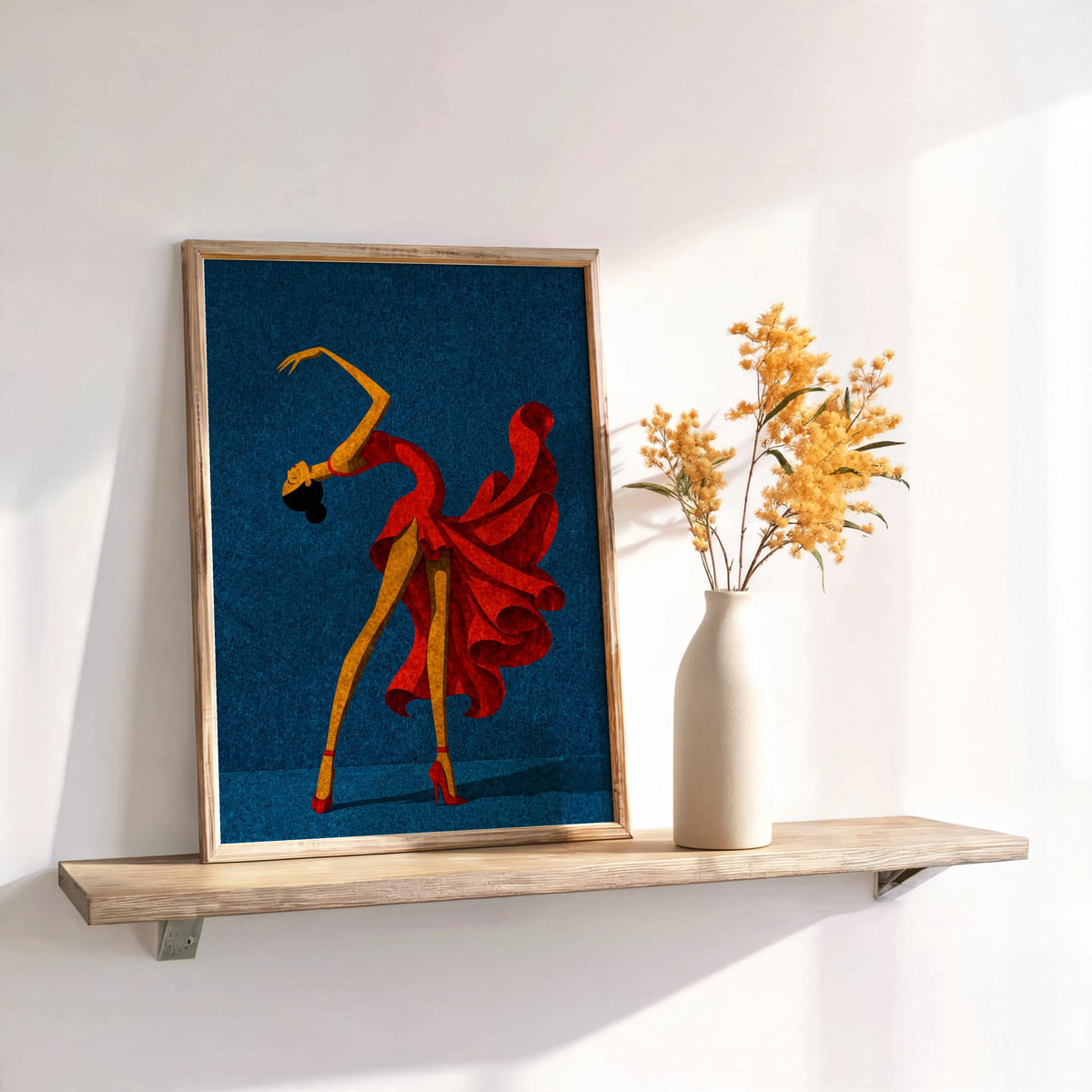 Deep blue salsa dancer wall art on shelf, vibrant red dress dancer print next to dried florals