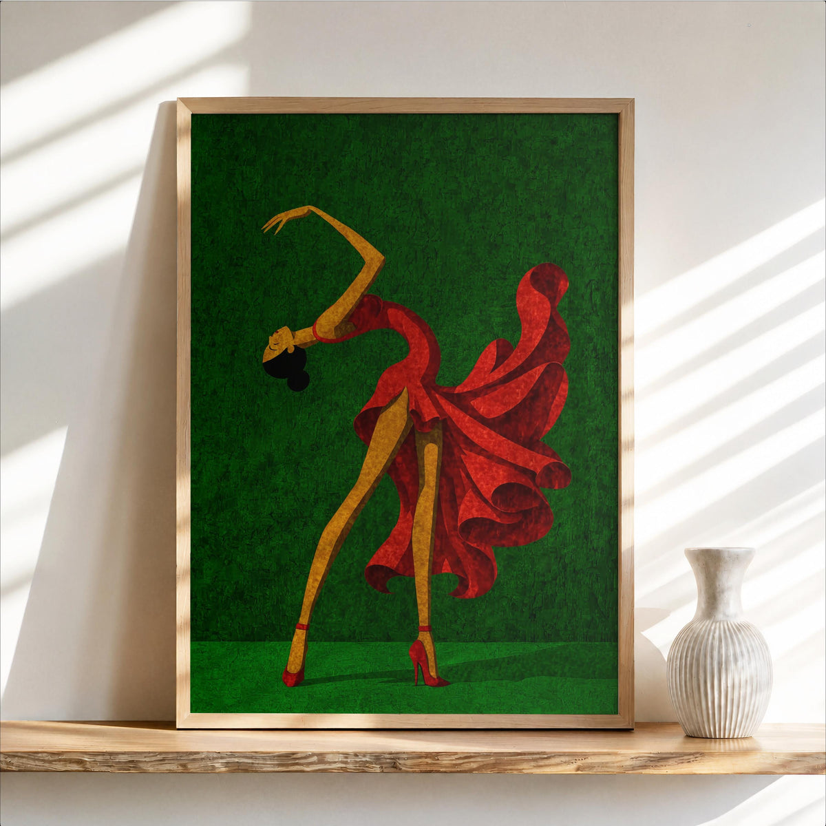 Salsa dancer wall art with grass green backdrop, swirling red dress, framed on wooden shelf