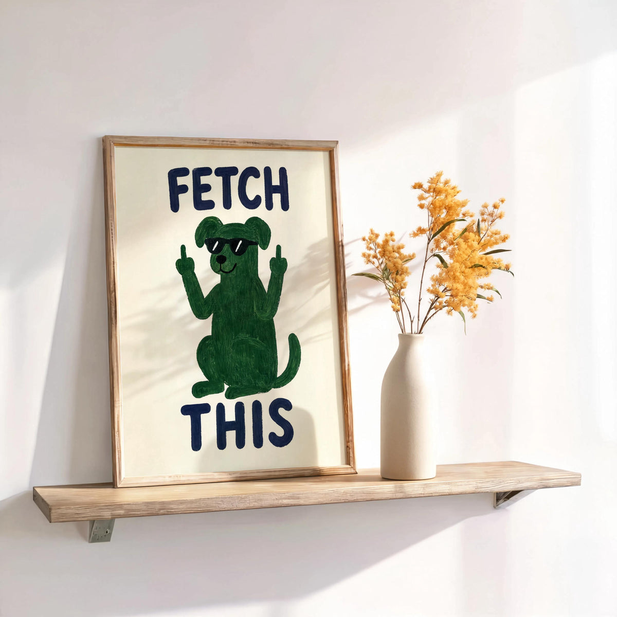 Wood shelf with framed green dog print and dried flowers, bold navy FETCH THIS text, dog lover wall art for entryways