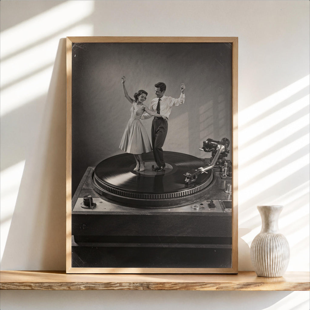 Framed black-and-white record player wall art, dancing couple on vinyl, sunlit shelf vignette