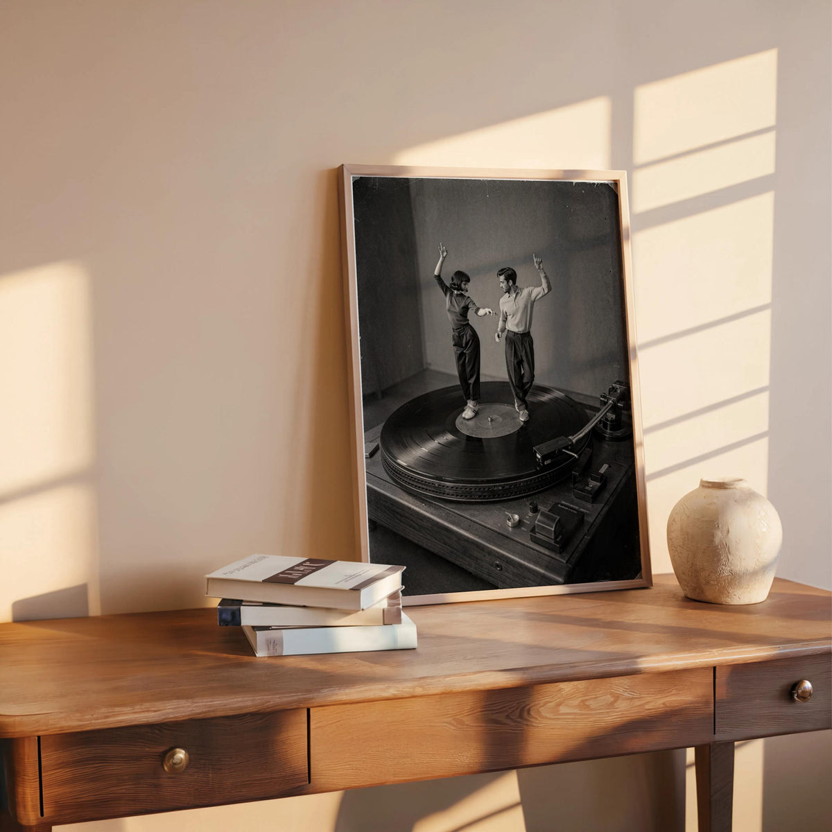Angled framed black and white dance print on desk, vinyl record wall art with textured surreal photography
