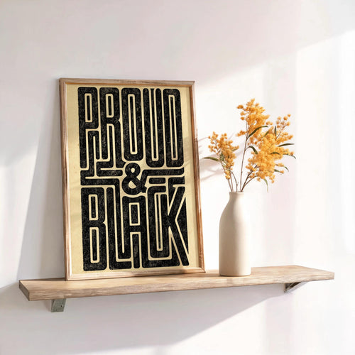 Narrow shelf display with Proud and Black poster, dried flowers in a vase, warm retro typography vibe