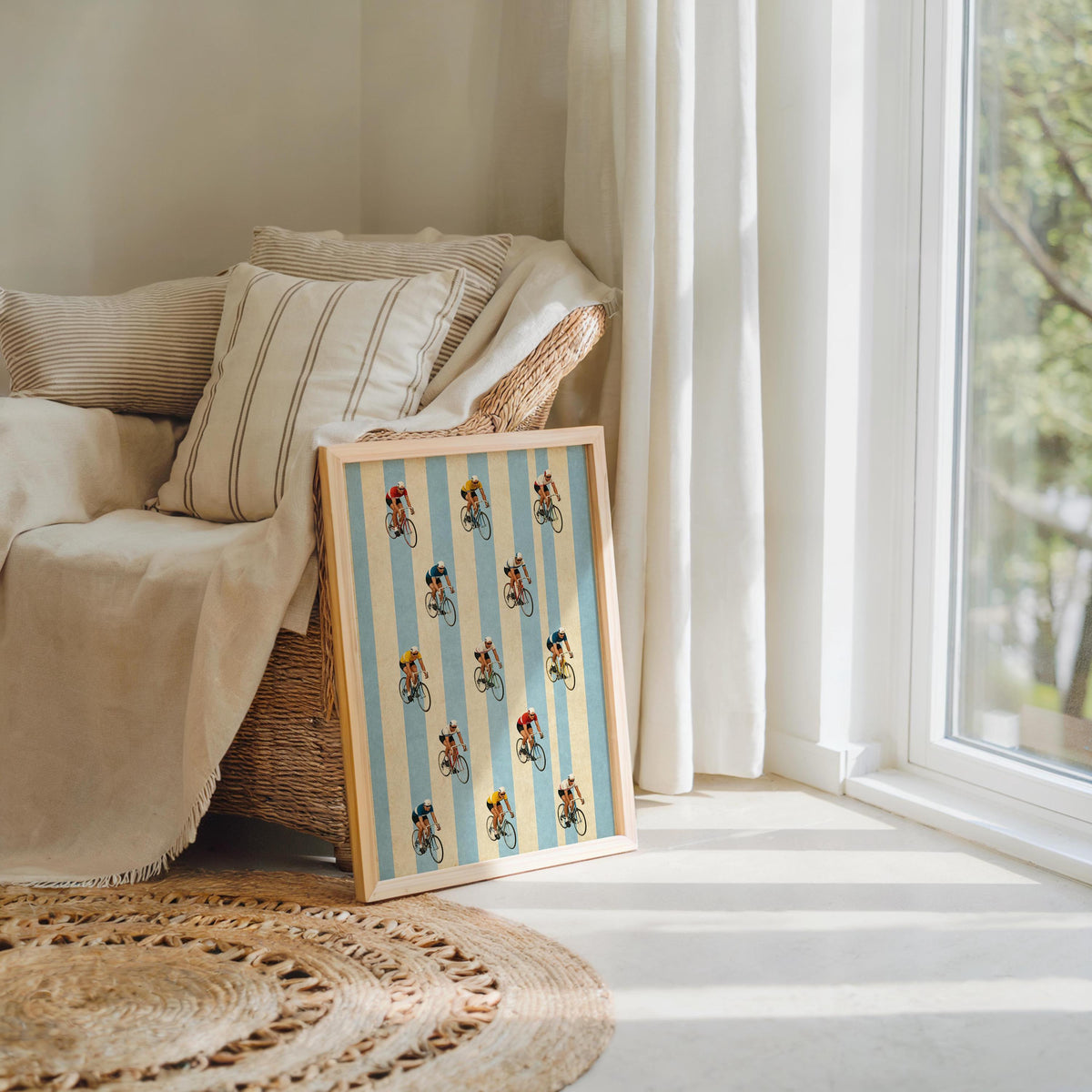 Leaned retro cycling wall art by cozy sofa, woven rug and soft throw, perfect bike room decor or nursery.