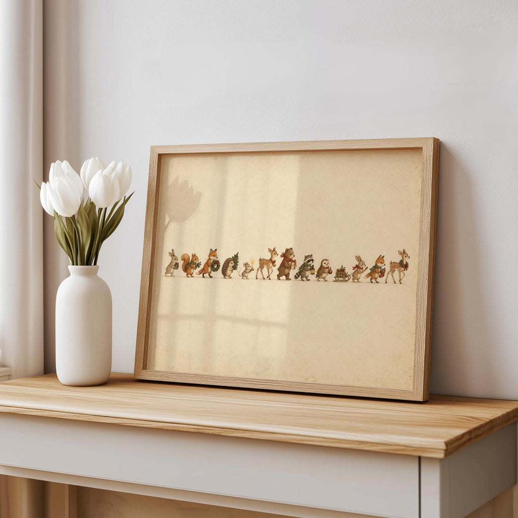 Woodland animal Christmas print in a distressed frame on a console, white vase with tulips nearby