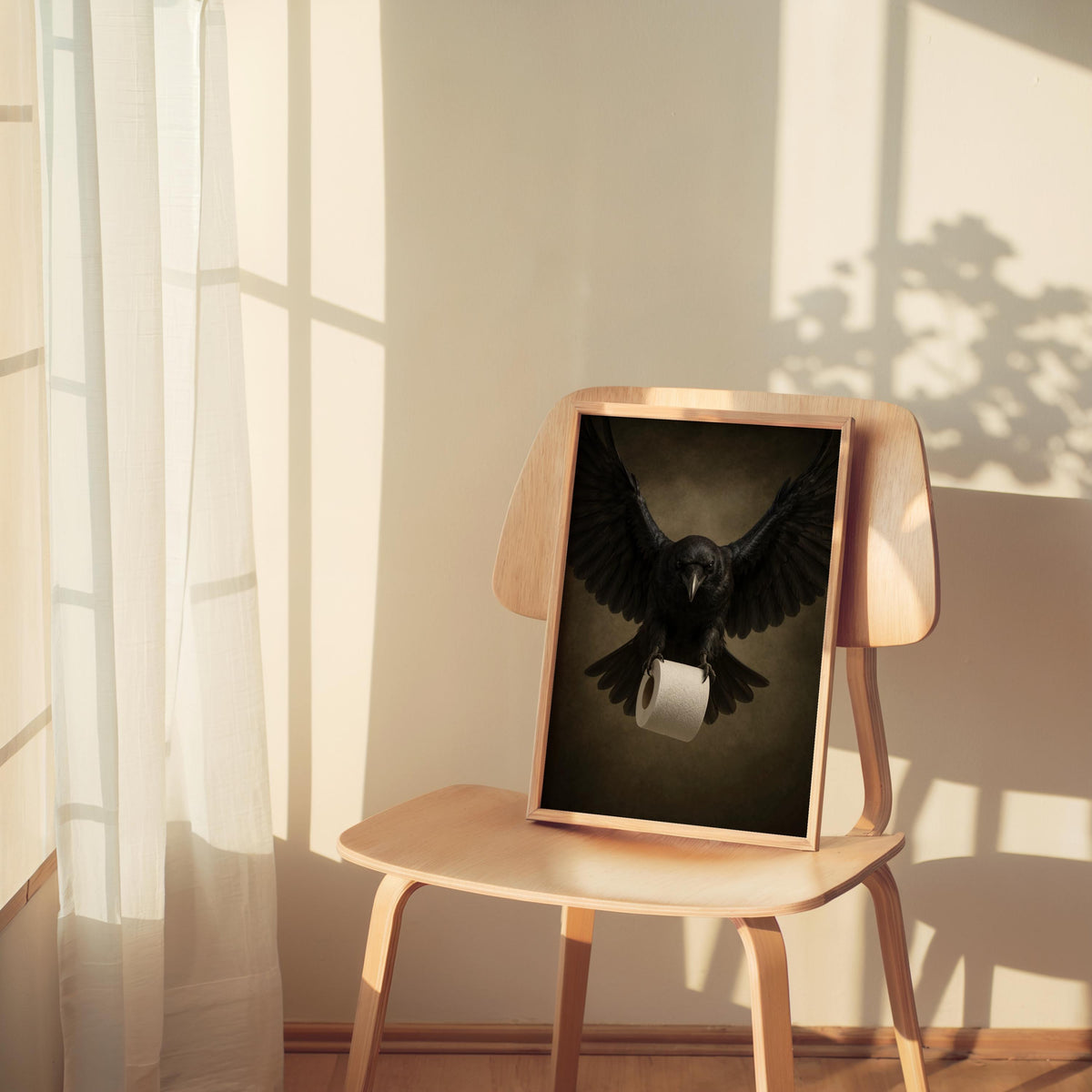 Sunlit corner with small framed raven bathroom wall art on a chair, witchy bathroom wall art, muted vintage palette.