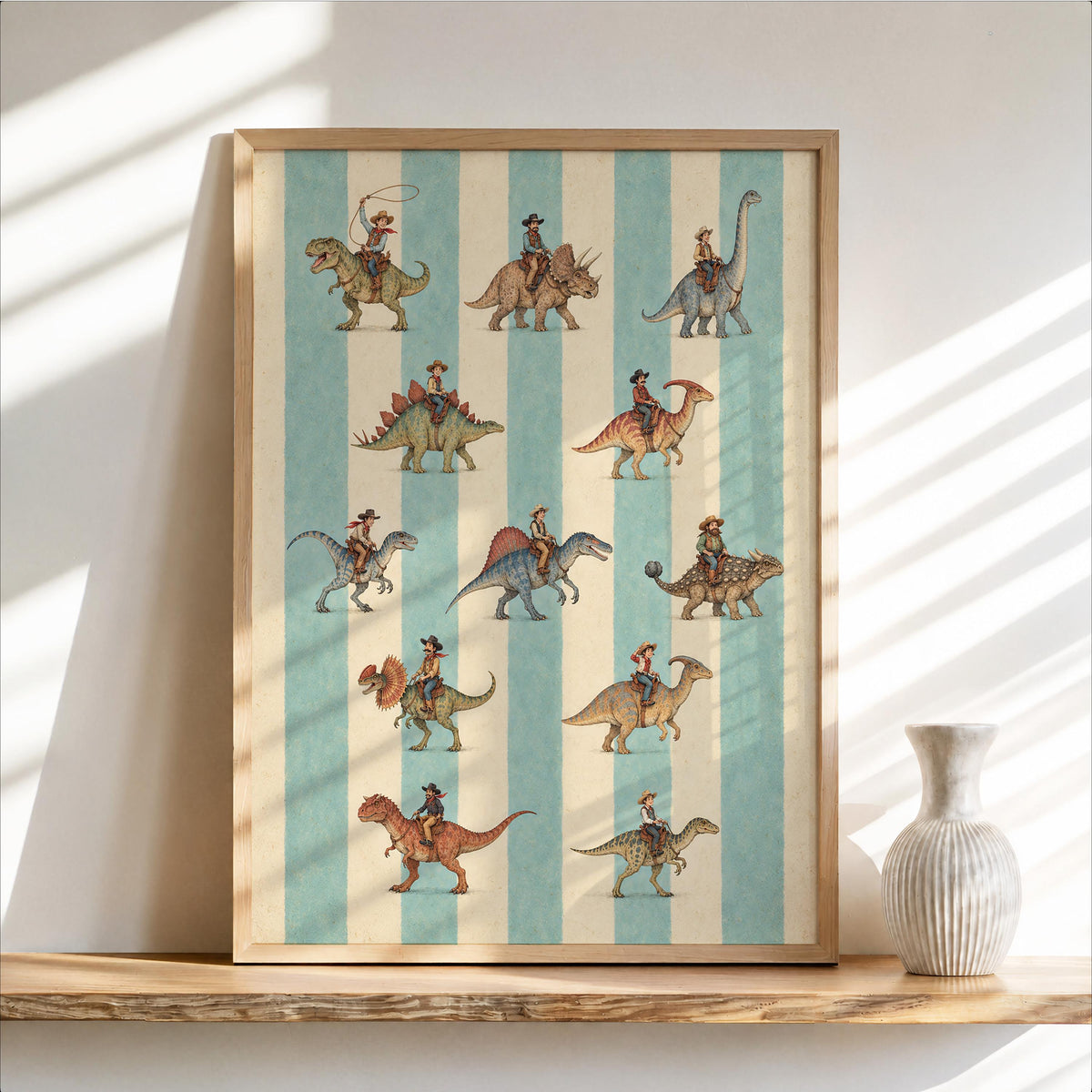 Framed cowboy dinosaur art print leaning on a wooden shelf, pale turquoise and cream striped background