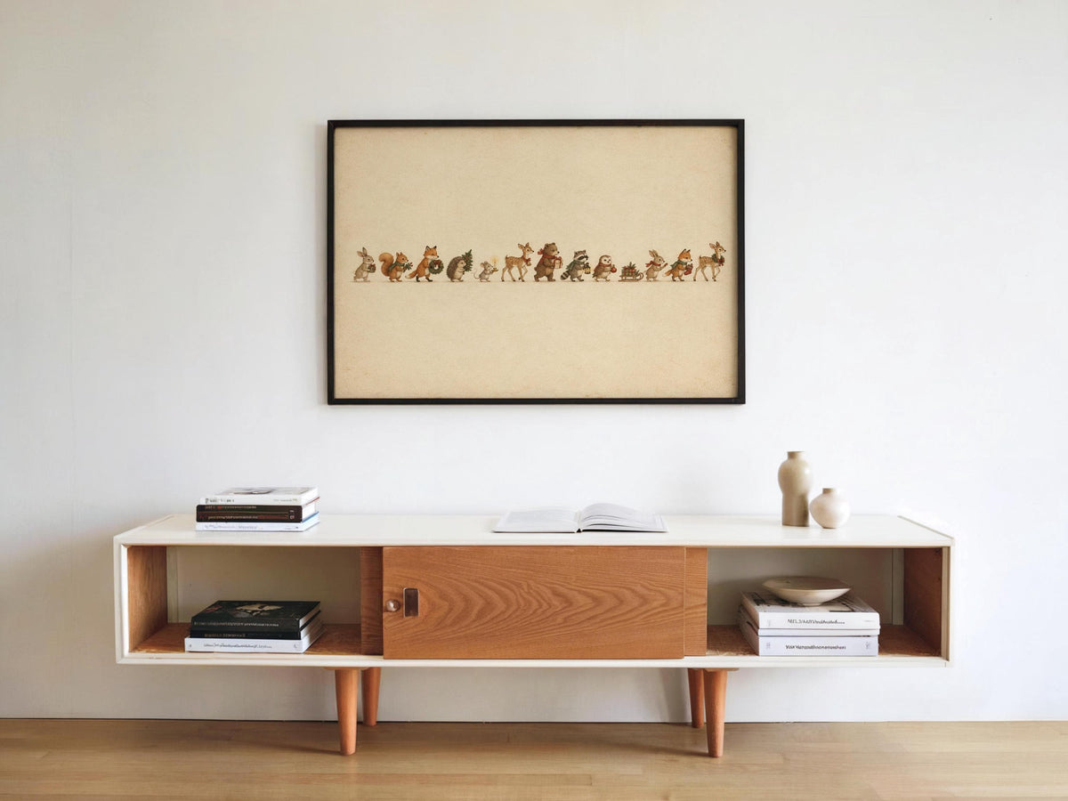 Woodland animal Christmas print framed above a low console, minimalist living room styling and decor