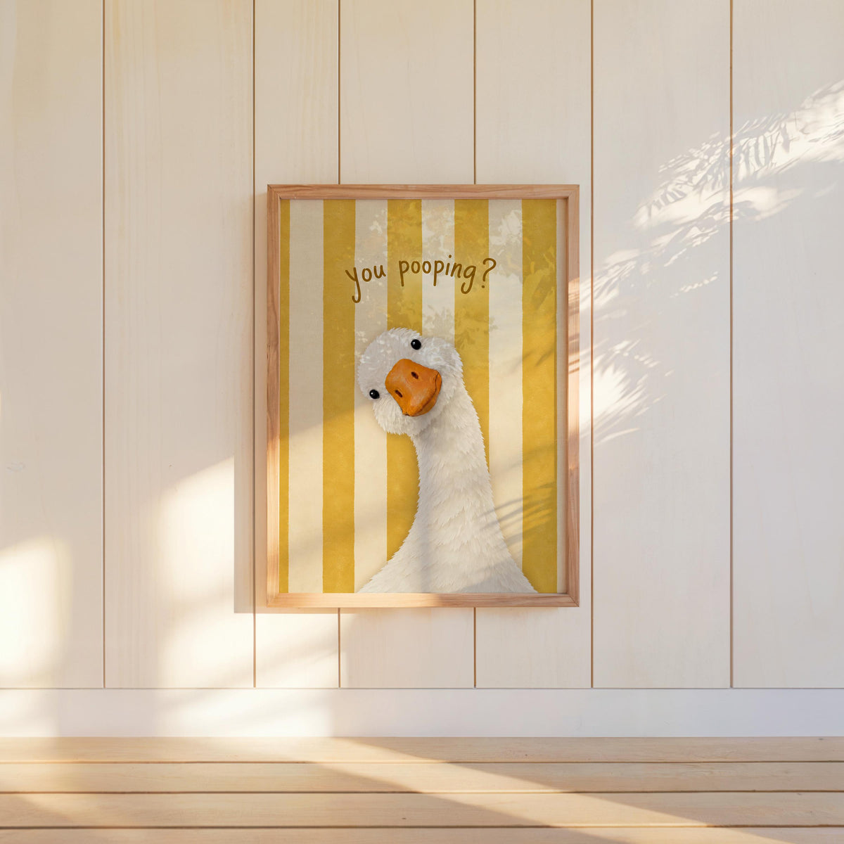 Yellow striped framed funny goose bathroom print mounted on wall, retro striped goose print for toilet humor