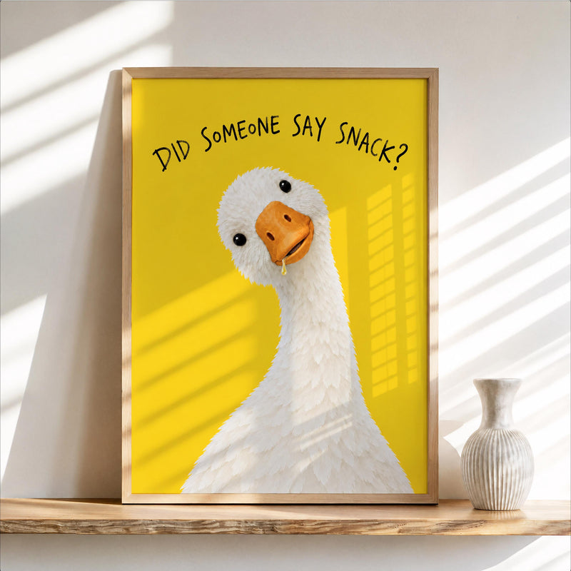 Sunlit framed yellow goose poster leaning on a wooden shelf with vase, funny goose wall art kitchen accent