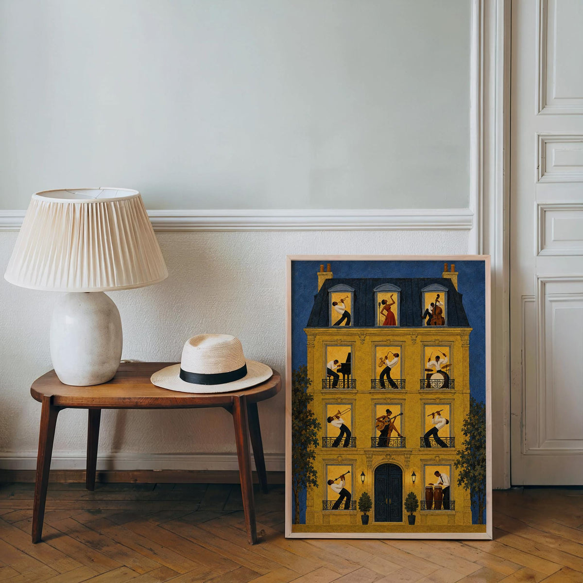 Smaller unframed jazz music wall art print on floor by lamp, cozy corner, jazz musicians art tones