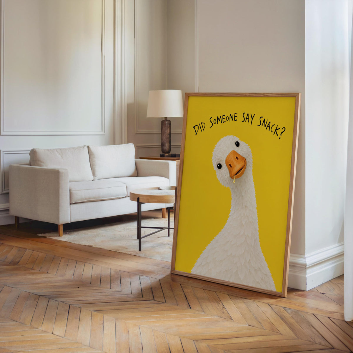 Tall yellow goose poster leaning near a sofa in a sunlit living room, silly goose print for a playful kitchen nook